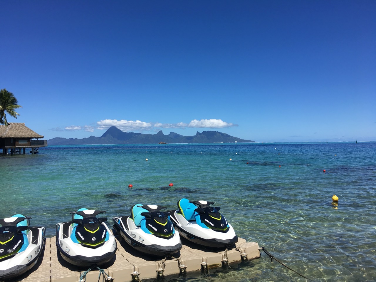 Jet skis beside clear ocean water in Tahiti